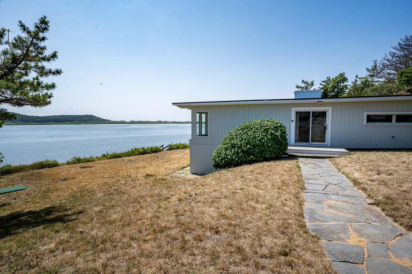 945 Chequessett Neck Road Wellfleet, MA 02667 - Photo 56 of 57 a view of a house with a yard