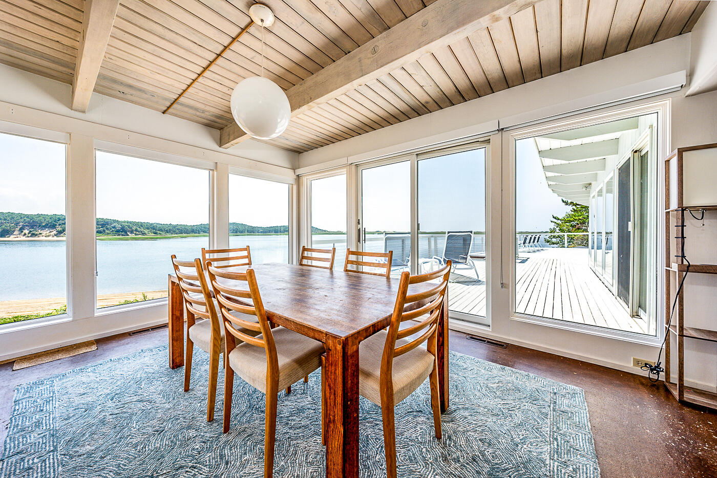 945 Chequessett Neck Road Wellfleet, MA 02667 - Photo 7 of 57 a dining room with furniture and wooden floor