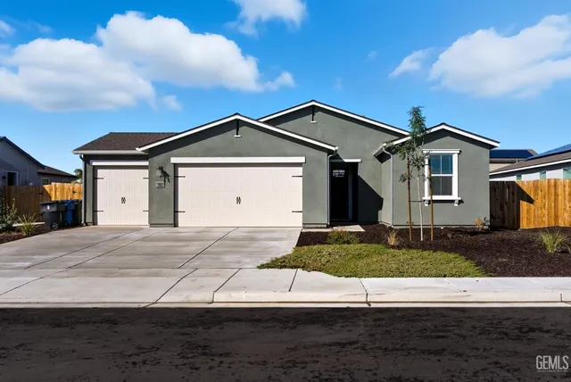 a front view of a house with garage