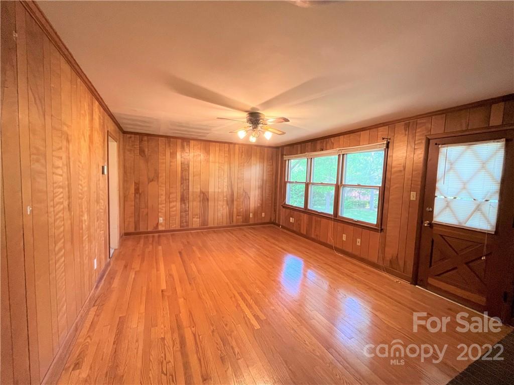 506 8th Street Southwest Conover, NC 28613 - Photo 12 of 38 a view of an empty room with a window and wooden floor