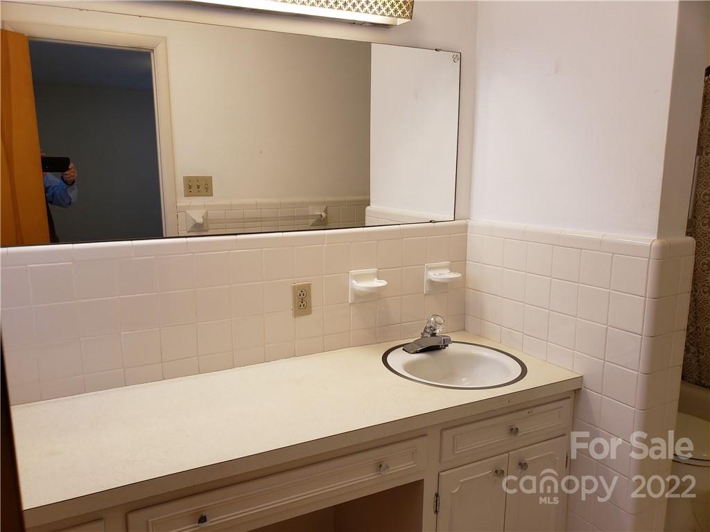 506 8th Street Southwest Conover, NC 28613 - Photo 24 of 38 a bathroom with a sink and a mirror
