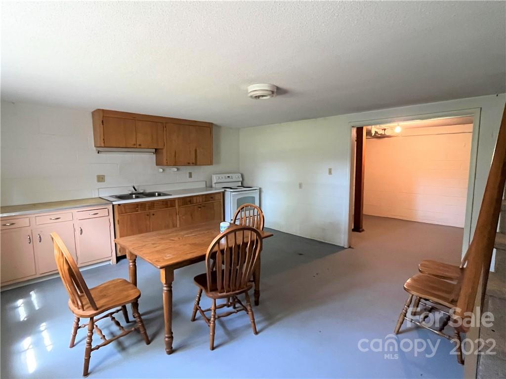 506 8th Street Southwest Conover, NC 28613 - Photo 25 of 38 a dining room with furniture and a window