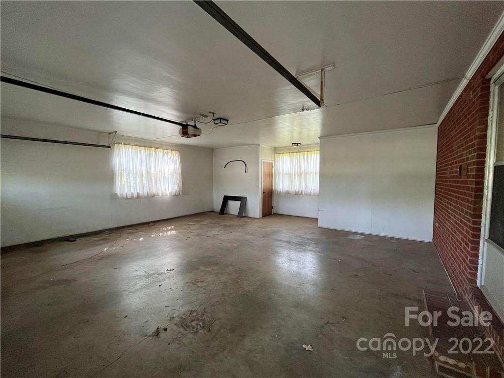 506 8th Street Southwest Conover, NC 28613 - Photo 33 of 38 an empty room with windows and fireplace