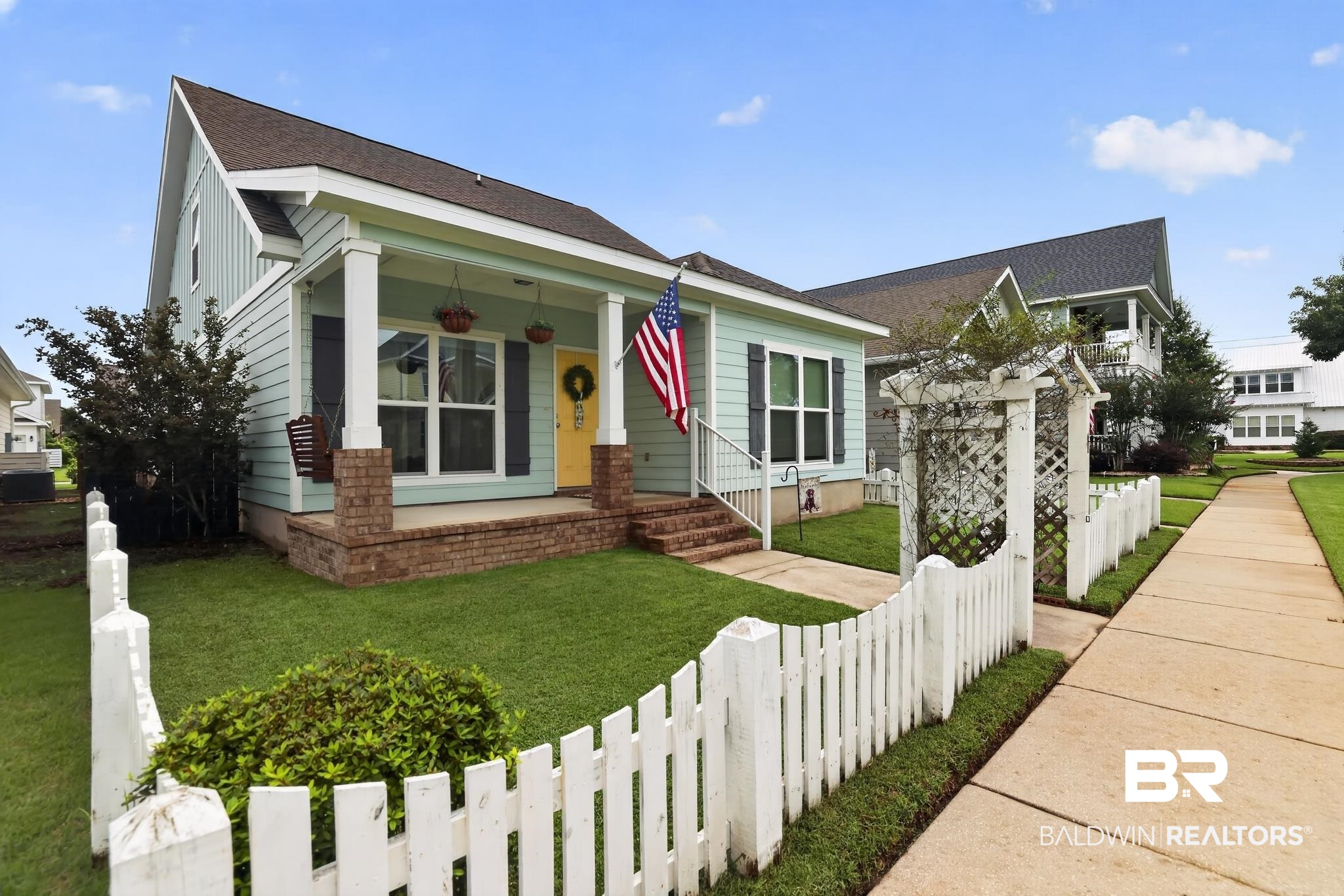 1210 Primrose Lane Foley, AL 36535 - Photo 3 of 33 Light blue siding exterior with a dark shingle roof