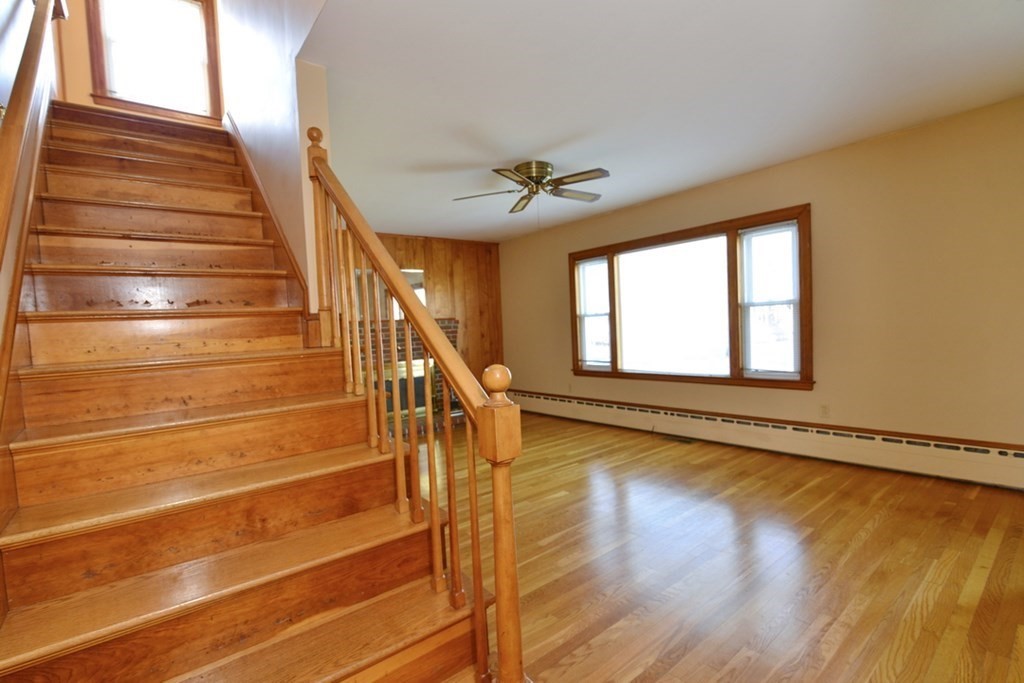 44 Everett Street Franklin, MA 02038 - Photo 12 of 31 a view of an empty room with wooden floor and a window