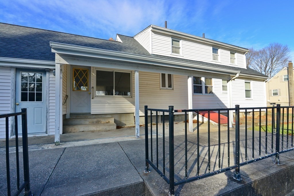 44 Everett Street Franklin, MA 02038 - Photo 3 of 31 a front view of a house with glass windows