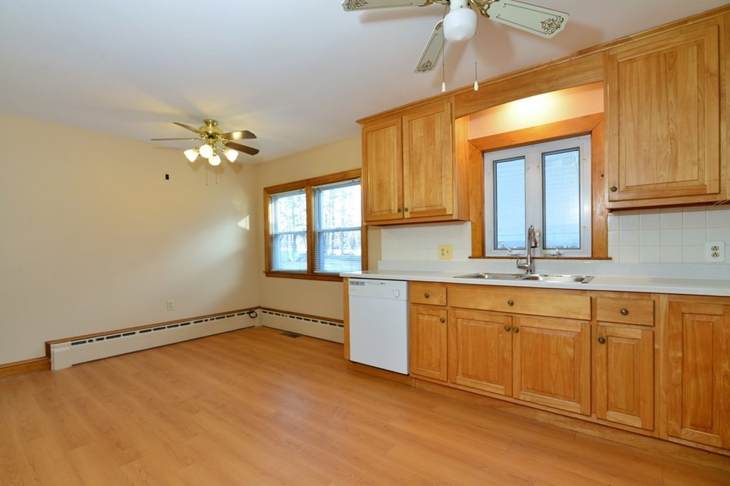 44 Everett Street Franklin, MA 02038 - Photo 5 of 31 a kitchen with a sink cabinets and window