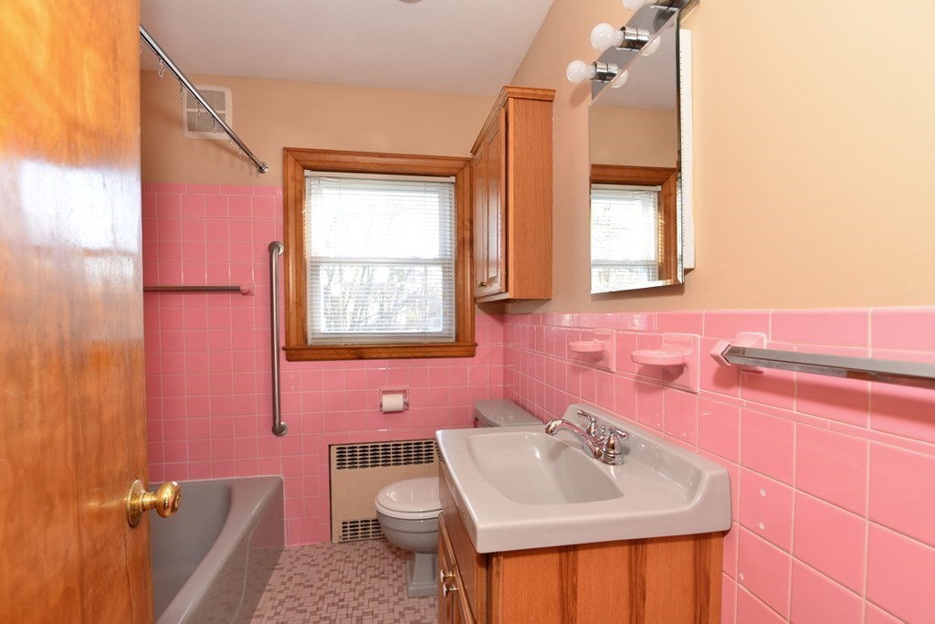 44 Everett Street Franklin, MA 02038 - Photo 9 of 31 a bathroom with a sink toilet and mirror