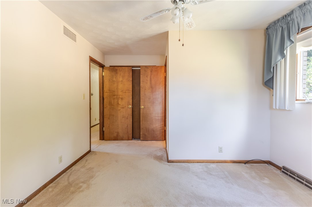155 Forest Road Weirton, WV 26062 - Photo 14 of 28 Spare room featuring light colored carpet and a ceiling fan