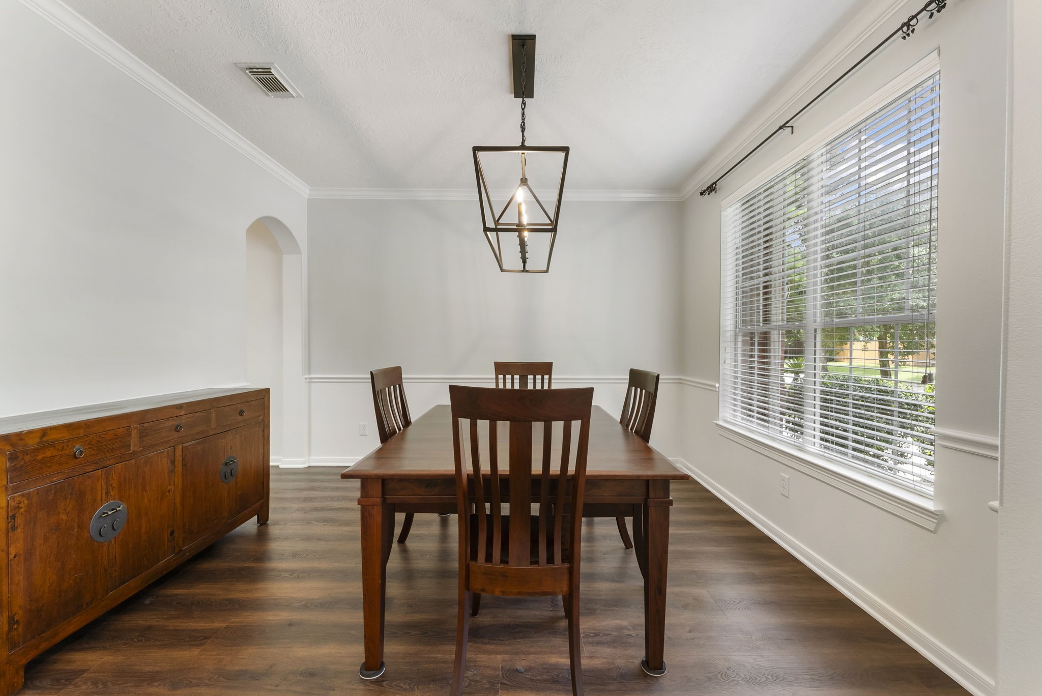 6643 Knollbridge Lane Spring, TX 77379 - Photo 6 of 50 Formal dining room is large enough to host your dinner parties and boasts an updated light fixture and crown molding.