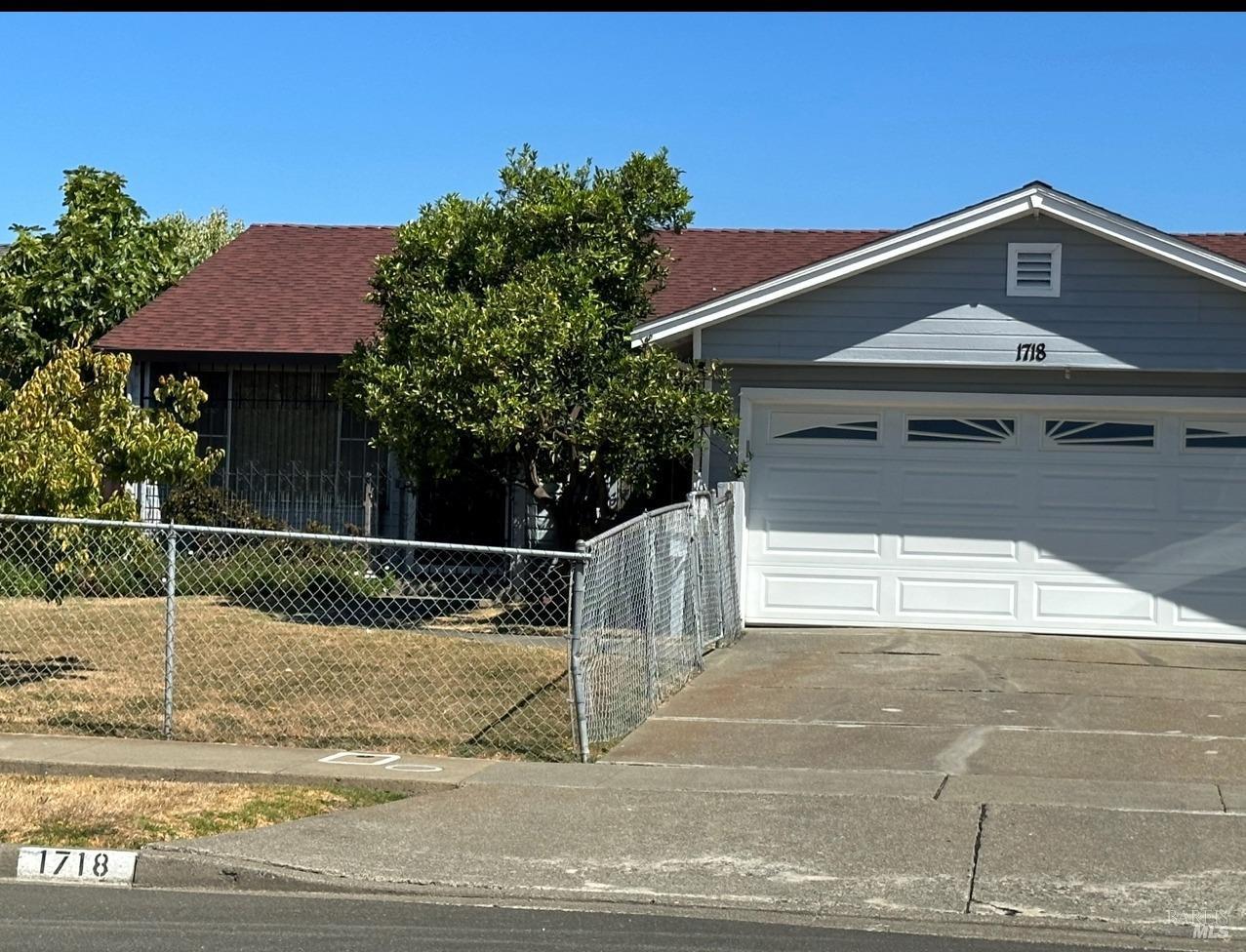 a front view of a house with garage
