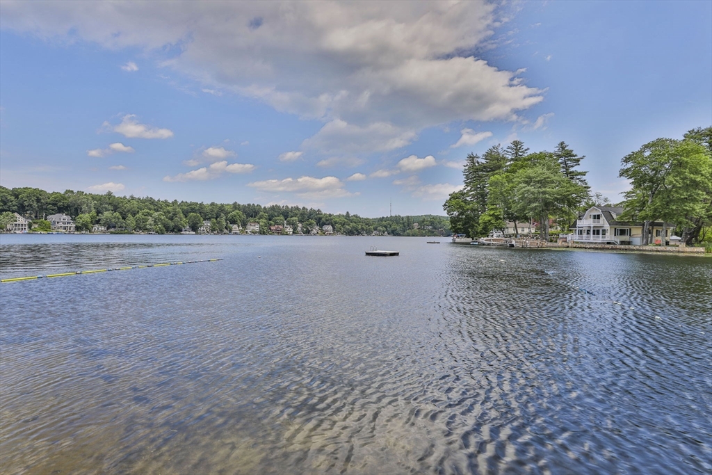 4 Cross Street Windham, NH 03087 - Photo 1 of 30 a view of a lake with houses in the back
