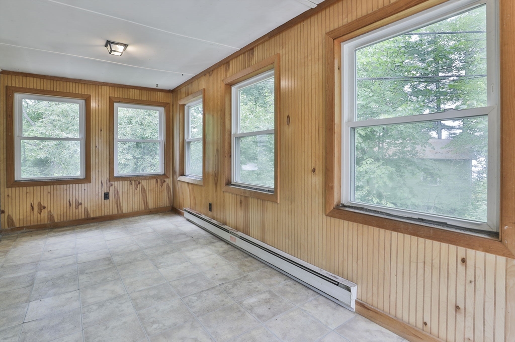 4 Cross Street Windham, NH 03087 - Photo 11 of 30 a view of an empty room with a window and a porch