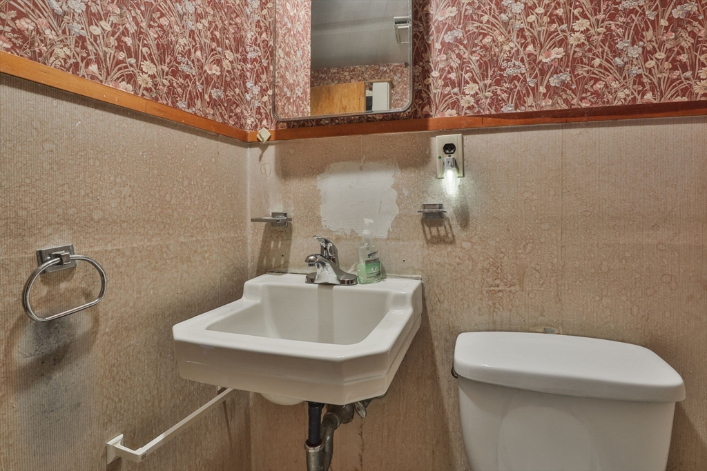 4 Cross Street Windham, NH 03087 - Photo 13 of 30 a bathroom with a sink a toilet and a mirror