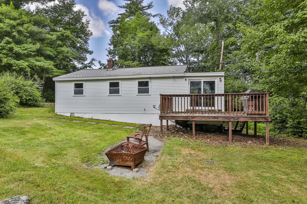 4 Cross Street Windham, NH 03087 - Photo 24 of 30 a backyard of a house with garden and outdoor seating