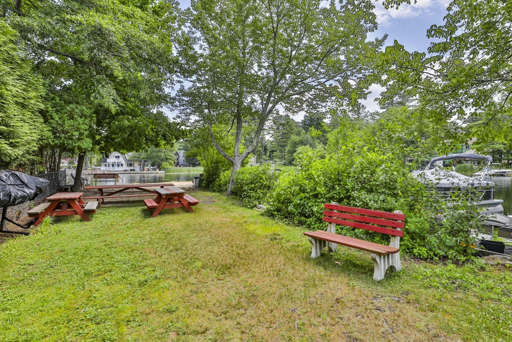 4 Cross Street Windham, NH 03087 - Photo 27 of 30 a backyard of a house with table and chairs