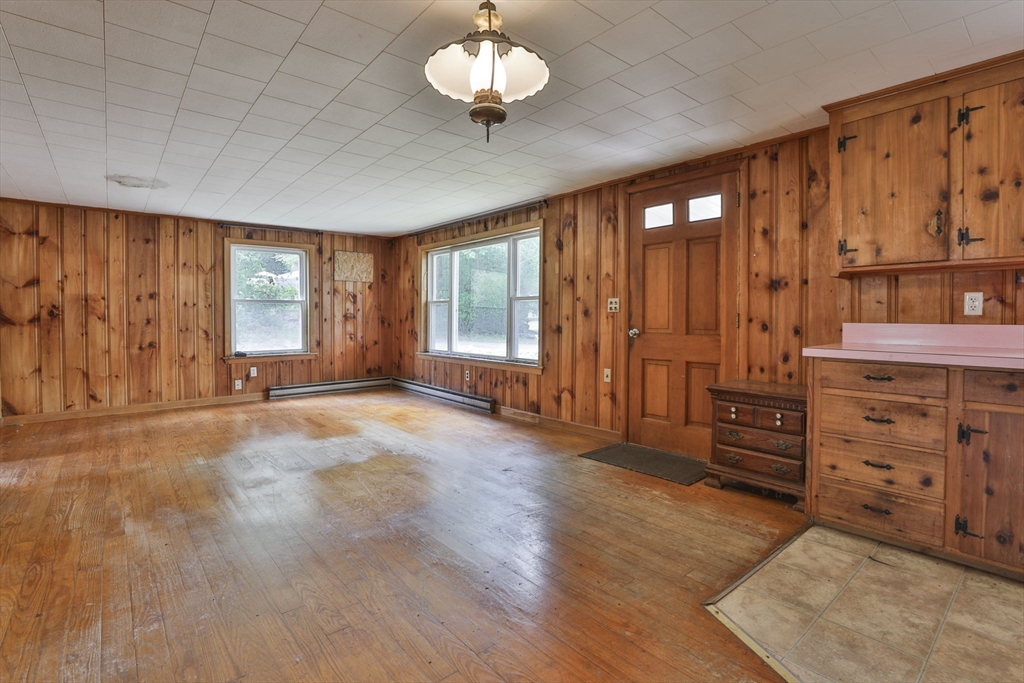 4 Cross Street Windham, NH 03087 - Photo 4 of 30 wooden floor in an empty room with a window