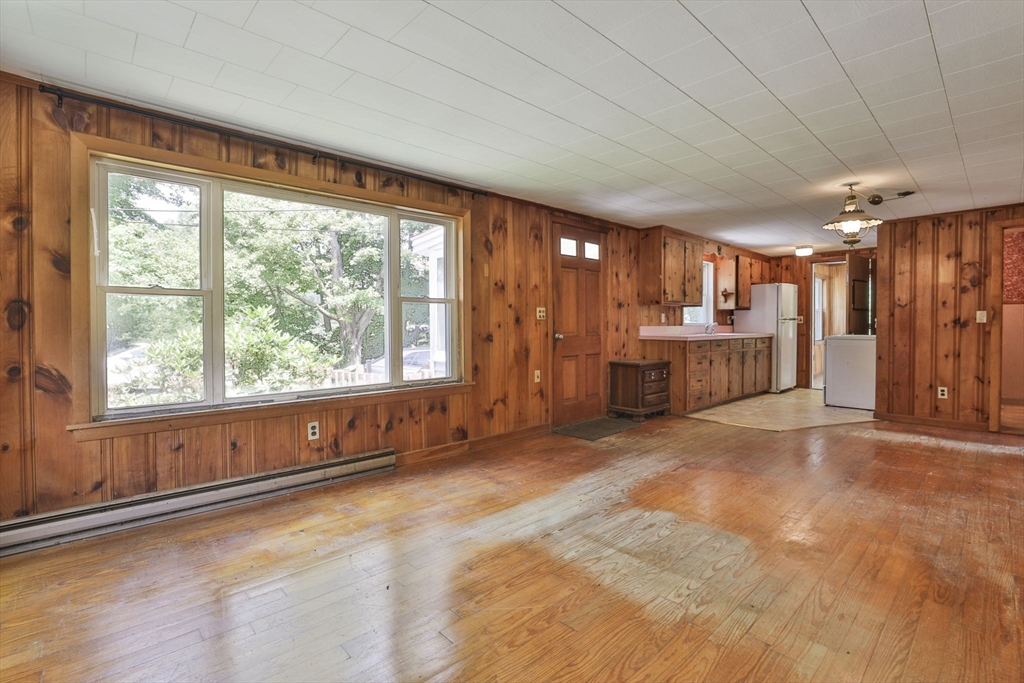 4 Cross Street Windham, NH 03087 - Photo 5 of 30 a big room with wooden floor and windows