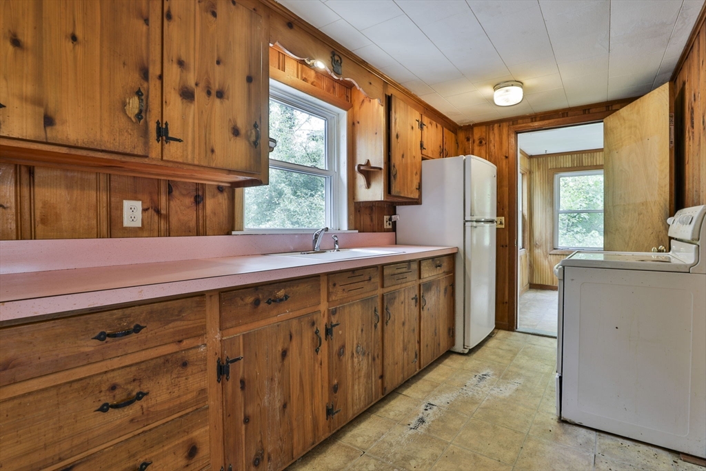 4 Cross Street Windham, NH 03087 - Photo 8 of 30 a kitchen with stainless steel appliances a stove and a refrigerator