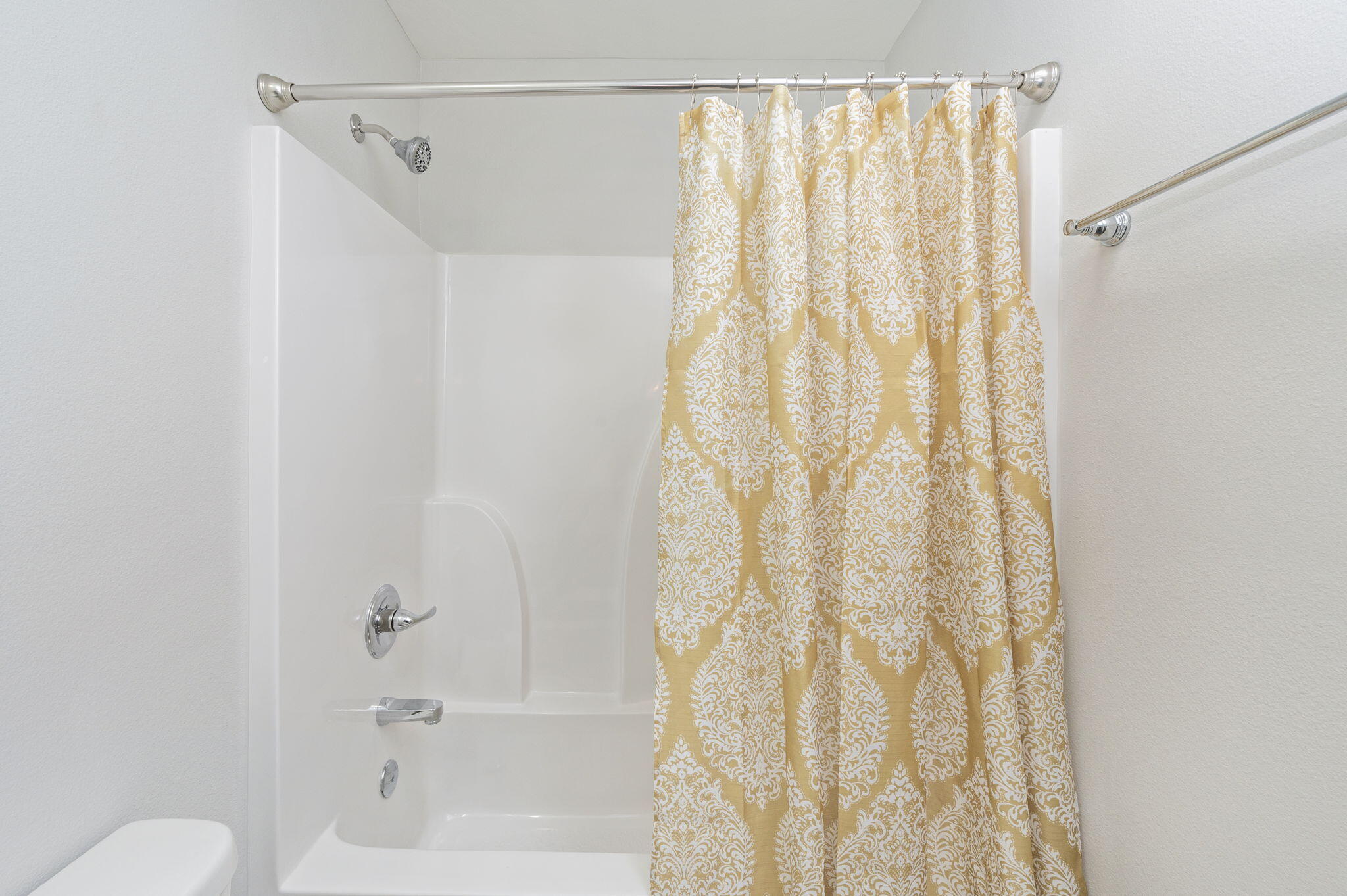 1204 Sunshine Drive Crestview, FL 32539 - Photo 22 of 28 a bathroom with a shower curtain and a curtain