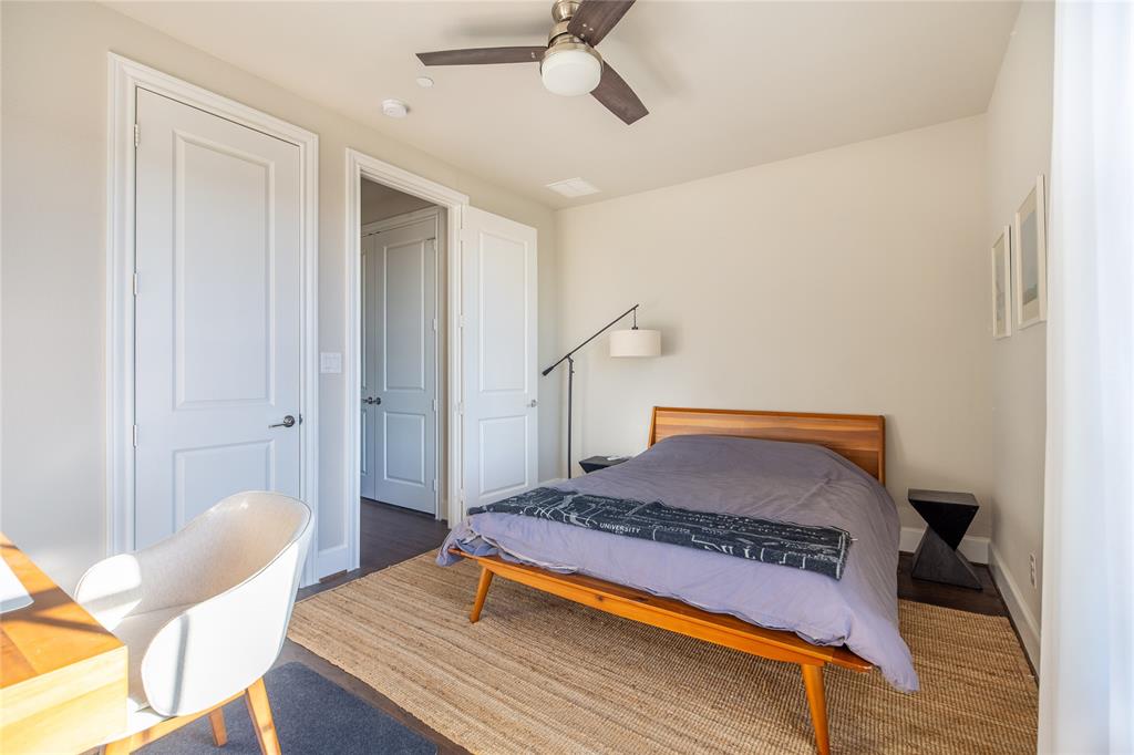 4116 Runyon Road Addison, TX 75001 - Photo 23 of 31 a bedroom with furniture and wooden floor