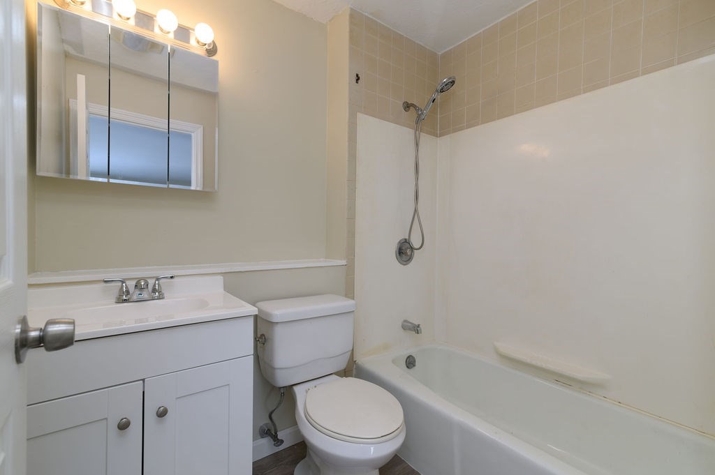 800 Bearses Way, Unit 2SF Hyannis, MA 02601 - Photo 13 of 23 a bathroom with a sink a toilet and shower