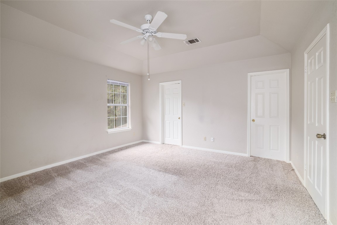 2509 Riddle Road Austin, TX 78748 - Photo 12 of 16 en empty room with windows and ceiling fan