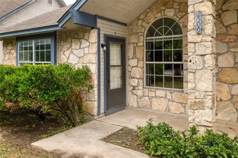 front view of a brick house with a large door