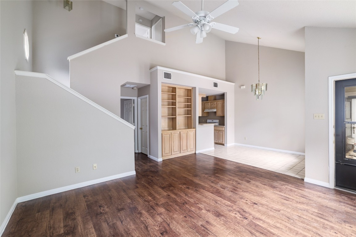 2509 Riddle Road Austin, TX 78748 - Photo 4 of 16 a view of an empty room with wooden floor and a window
