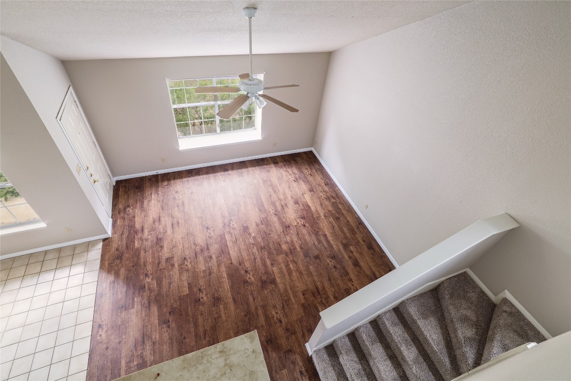 2509 Riddle Road Austin, TX 78748 - Photo 6 of 16 a view of an empty room with wooden floor and a window