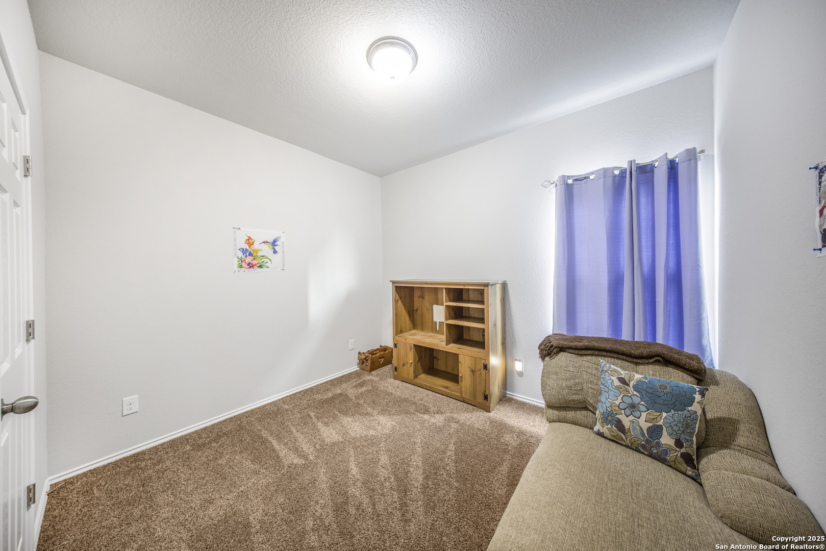 13115 Heathers Reef St. Hedwig, TX 78152 - Photo 15 of 23 a bedroom with a bed and a couch