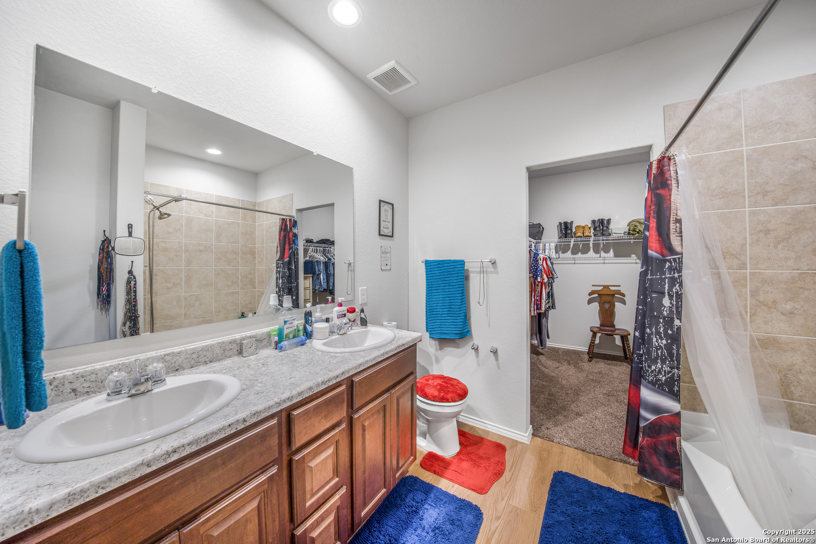 13115 Heathers Reef St. Hedwig, TX 78152 - Photo 20 of 23 a bathroom with a sink vanity granite and a mirror