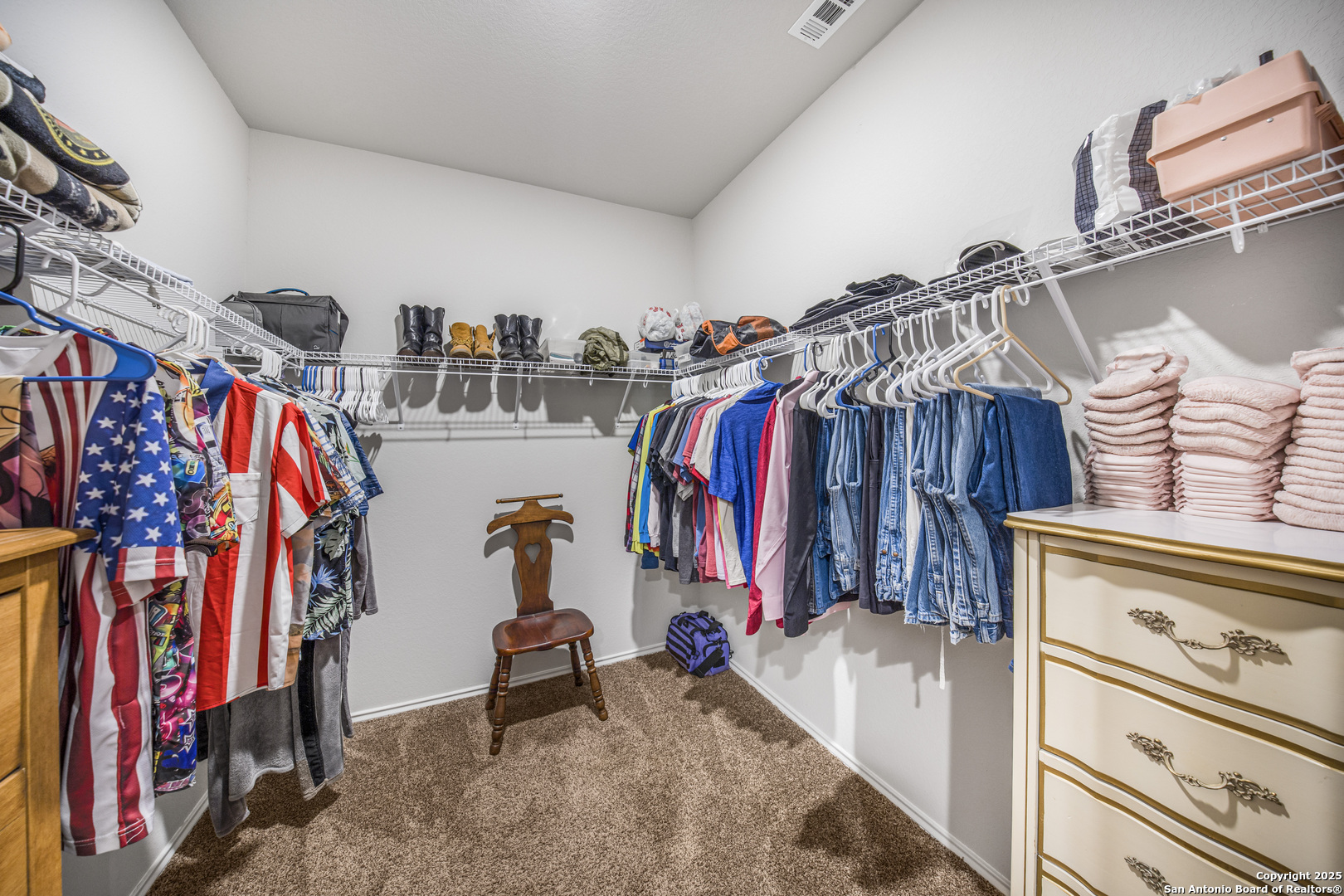 13115 Heathers Reef St. Hedwig, TX 78152 - Photo 21 of 23 a view of walk in closet with clothes