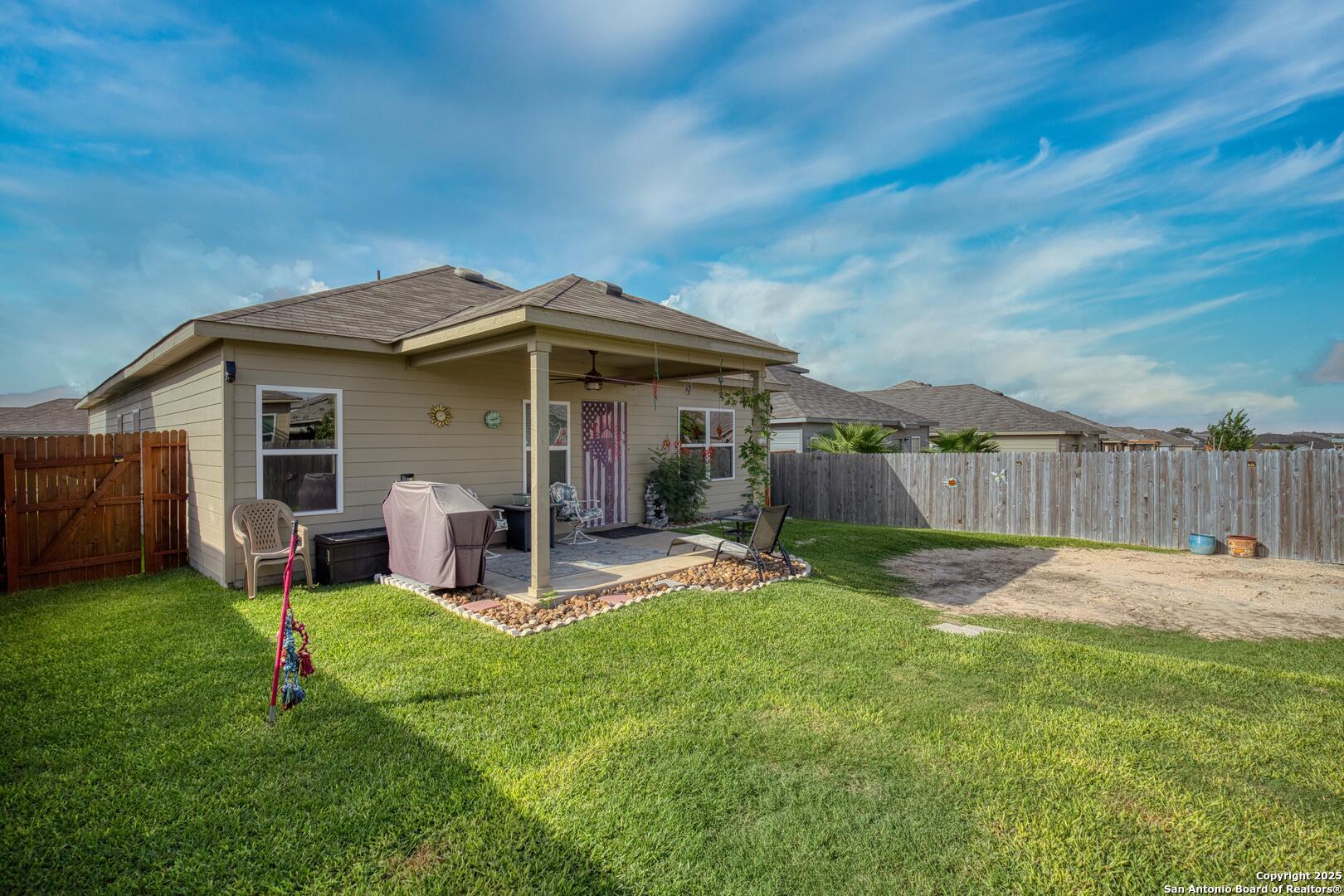 13115 Heathers Reef St. Hedwig, TX 78152 - Photo 22 of 23 a front view of a house with garden and porch