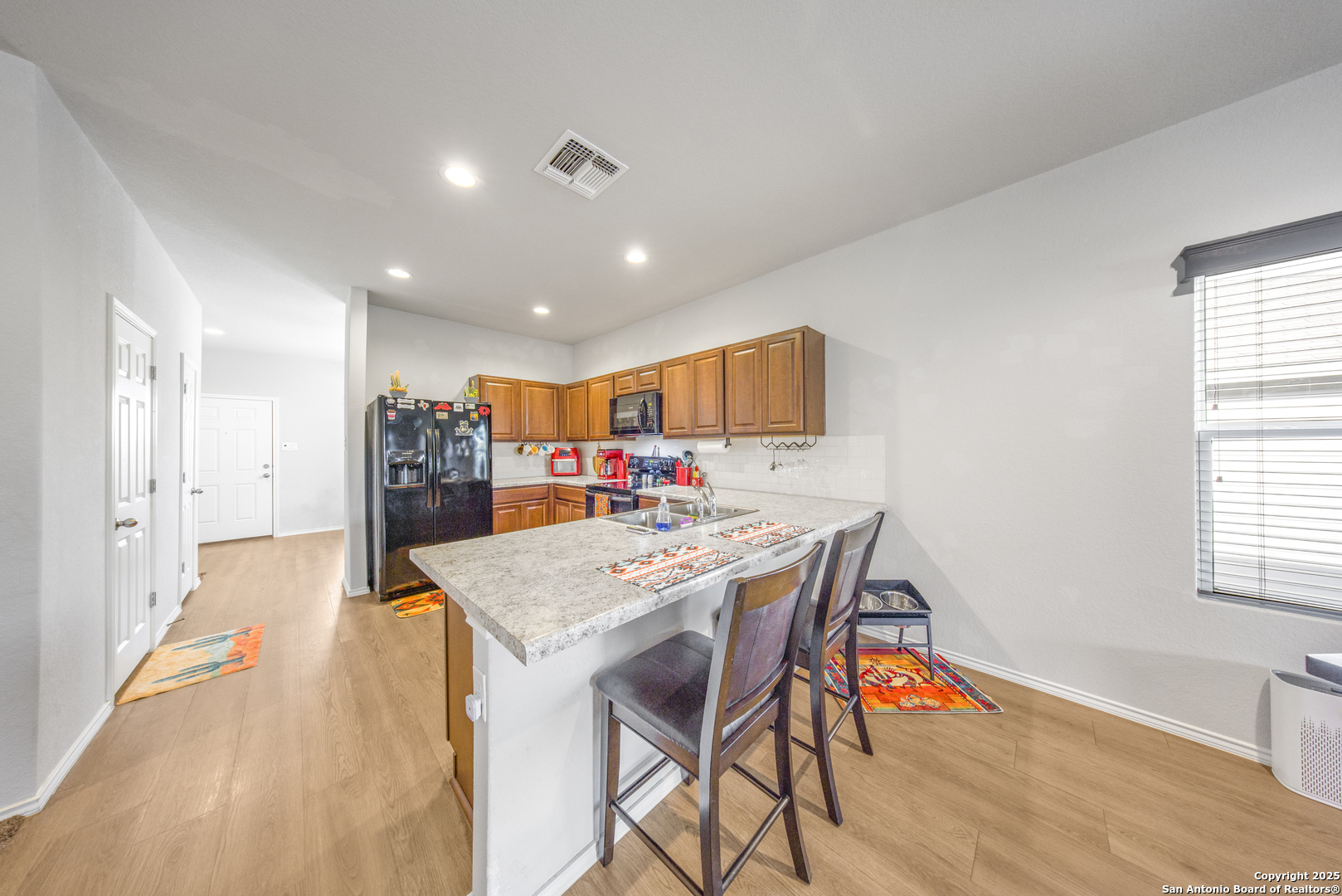 13115 Heathers Reef St. Hedwig, TX 78152 - Photo 3 of 23 a view of a dining room with furniture