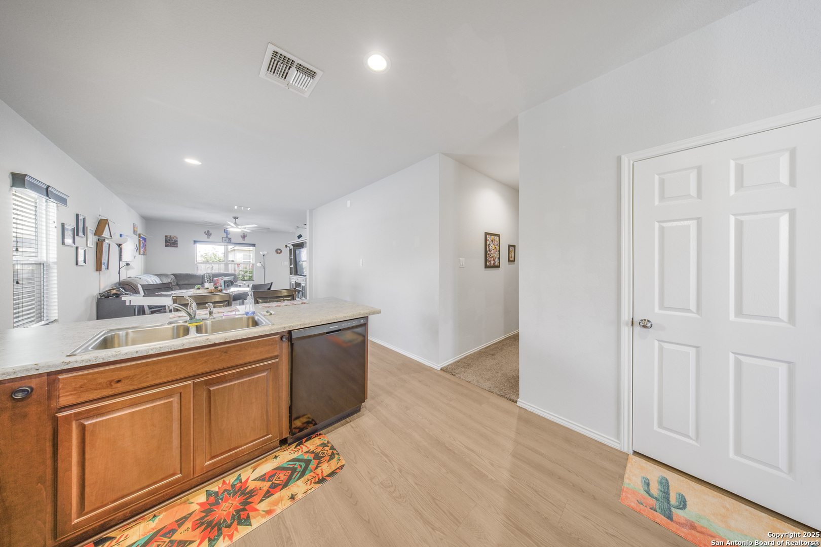 13115 Heathers Reef St. Hedwig, TX 78152 - Photo 4 of 23 a kitchen with stainless steel appliances granite countertop a sink and cabinets