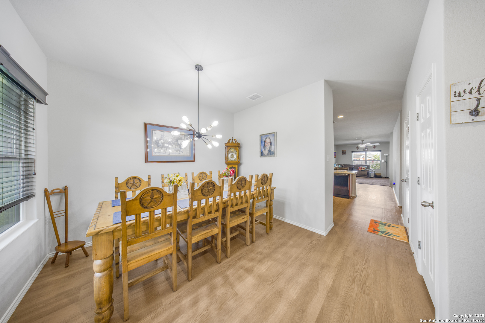 13115 Heathers Reef St. Hedwig, TX 78152 - Photo 6 of 23 a view of a dining room with furniture and a chandelier