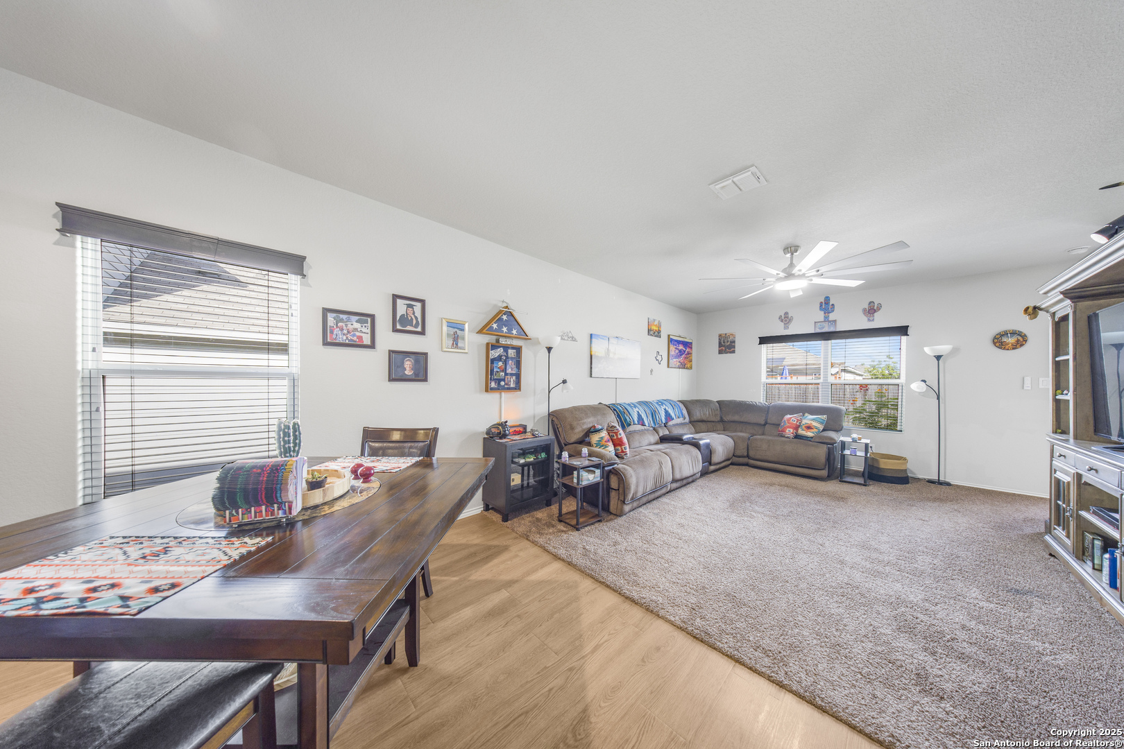 13115 Heathers Reef St. Hedwig, TX 78152 - Photo 9 of 23 a view of a livingroom and a dining room with furniture window and outside view