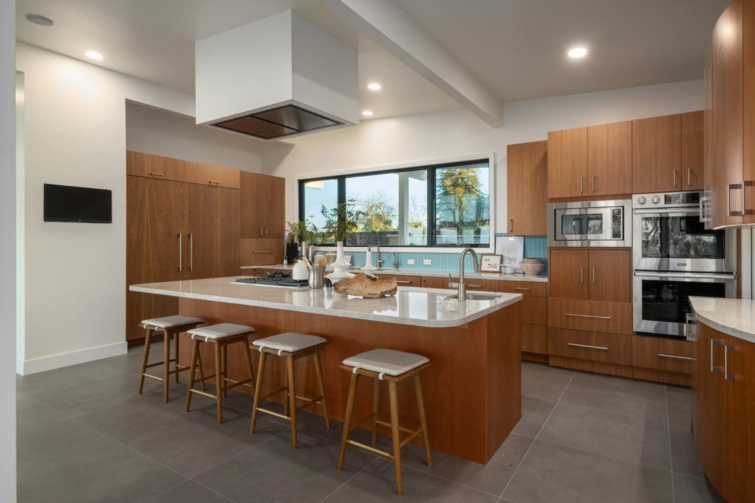 1230 West Moraga Road Fresno, CA 93711 - Photo 19 of 66 a dining table with chairs and window