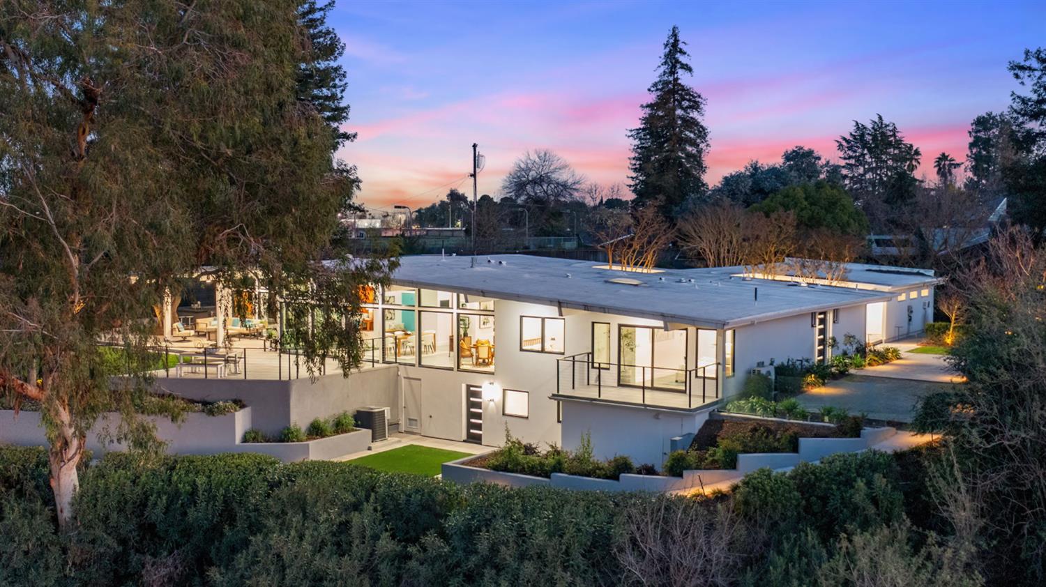 1230 West Moraga Road Fresno, CA 93711 - Photo 2 of 66 a front view of a house with a garden
