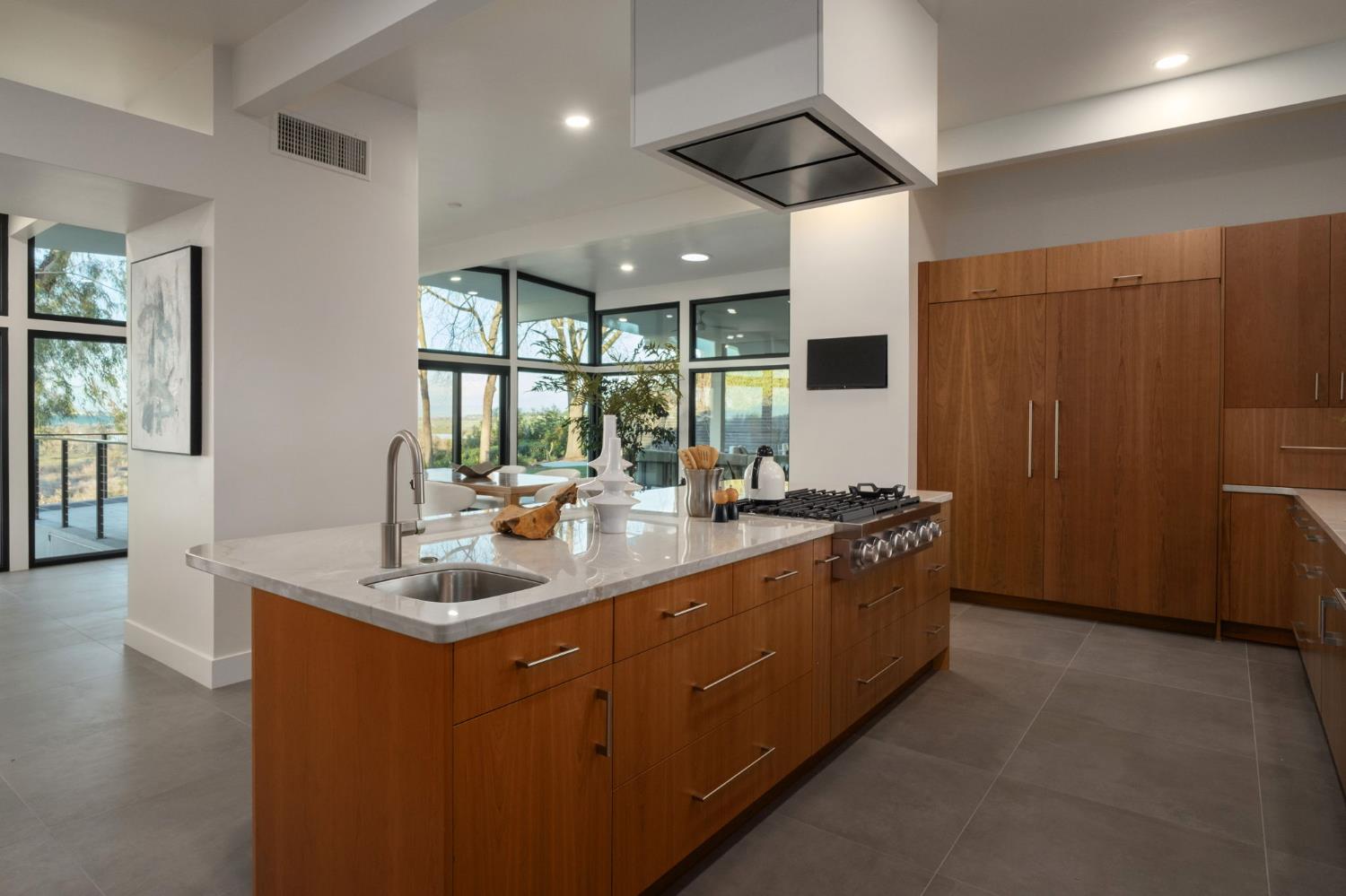 1230 West Moraga Road Fresno, CA 93711 - Photo 22 of 66 a kitchen with stainless steel appliances granite countertop a sink and a refrigerator