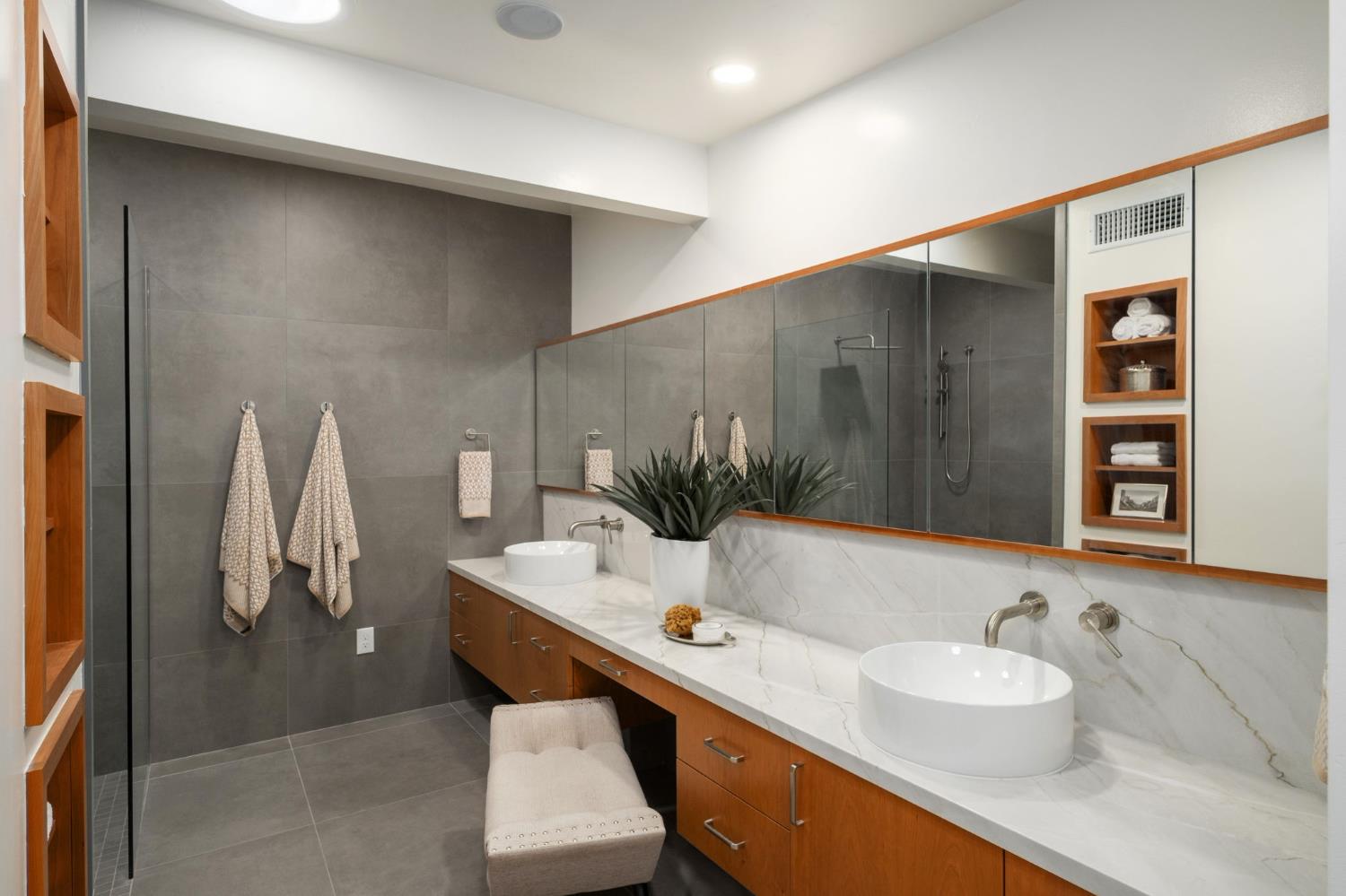 1230 West Moraga Road Fresno, CA 93711 - Photo 31 of 66 a bathroom with a double vanity sink and a mirror