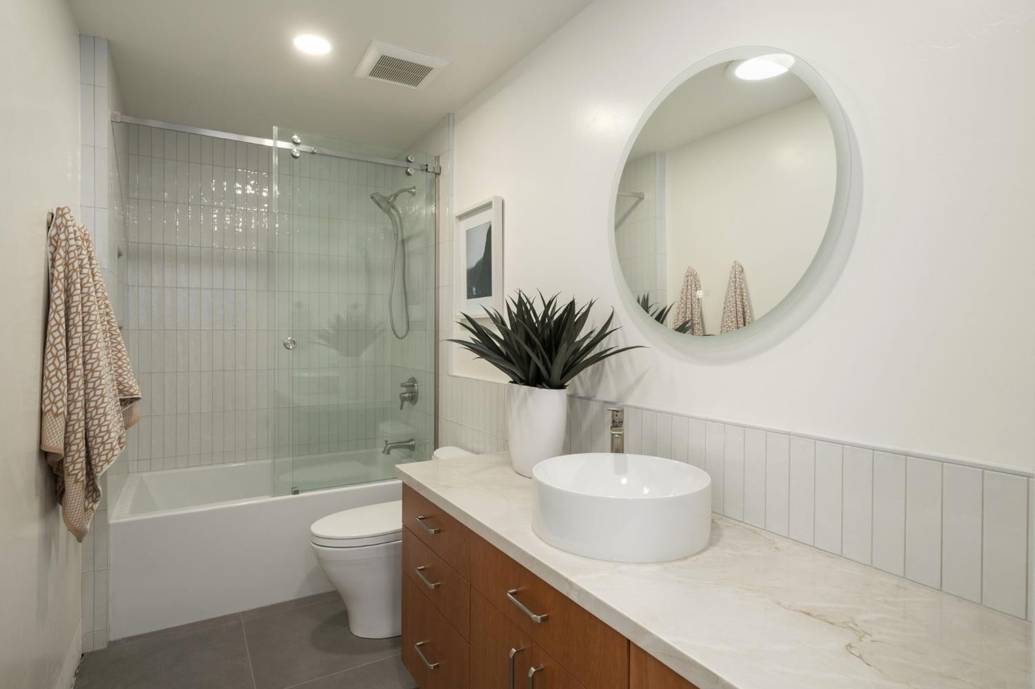 1230 West Moraga Road Fresno, CA 93711 - Photo 35 of 66 a bathroom with a double vanity sink toilet and shower