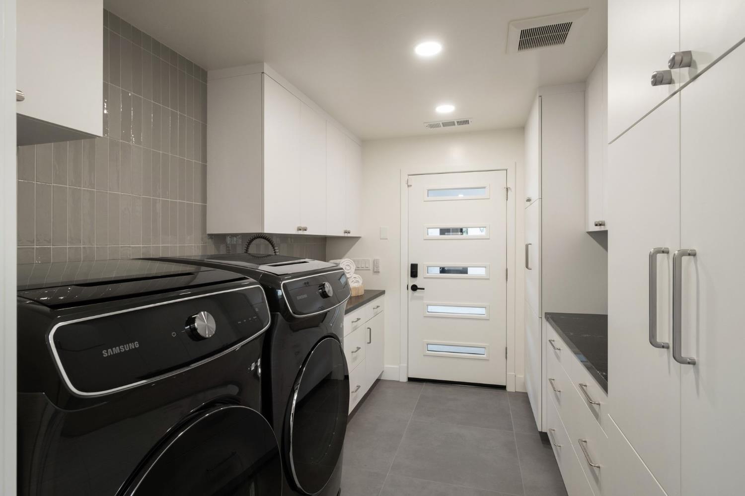 1230 West Moraga Road Fresno, CA 93711 - Photo 36 of 66 a utility room with dryer and washer