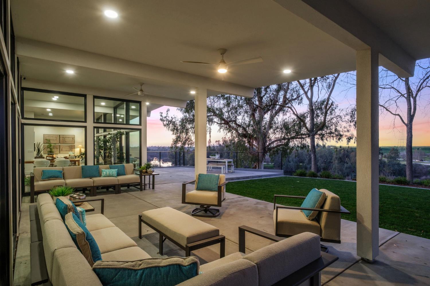 1230 West Moraga Road Fresno, CA 93711 - Photo 44 of 66 a outdoor living space with patio furniture and a garden