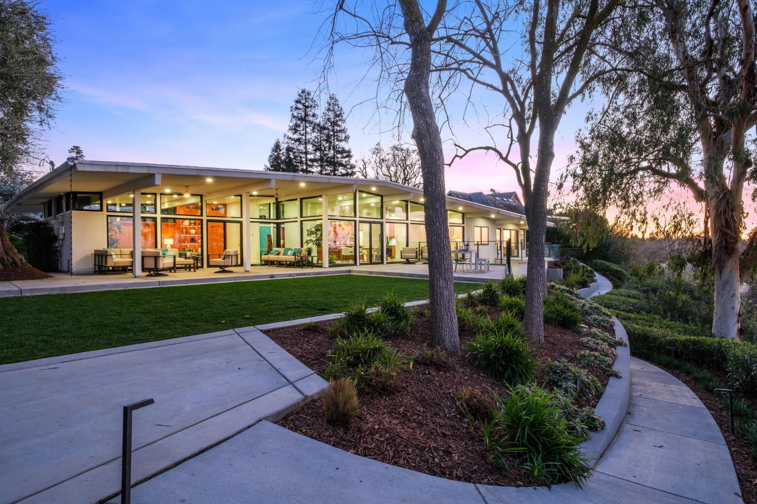 1230 West Moraga Road Fresno, CA 93711 - Photo 51 of 66 a front view of a house with garden