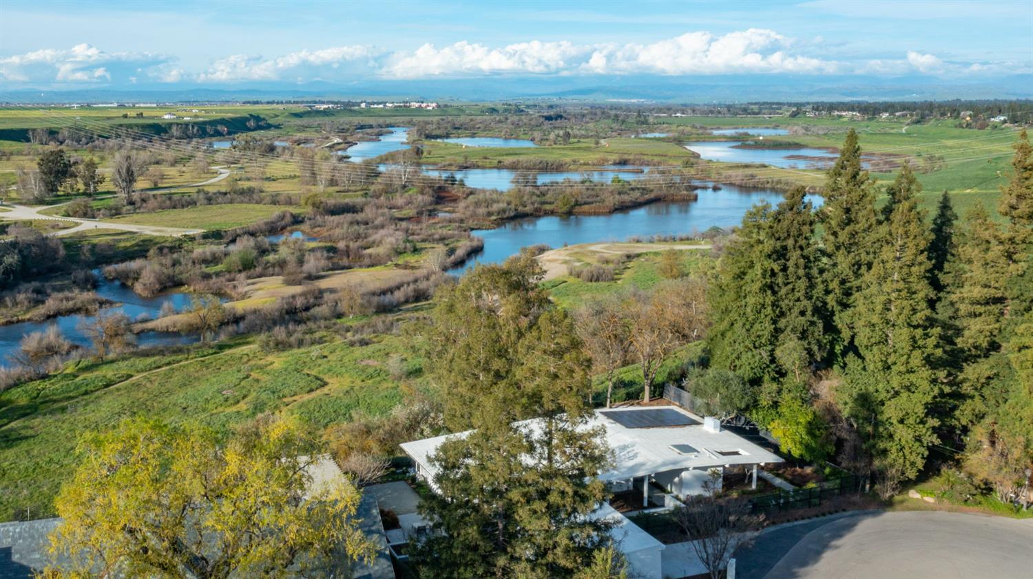 1230 West Moraga Road Fresno, CA 93711 - Photo 58 of 66 a view of a lake with lots of trees