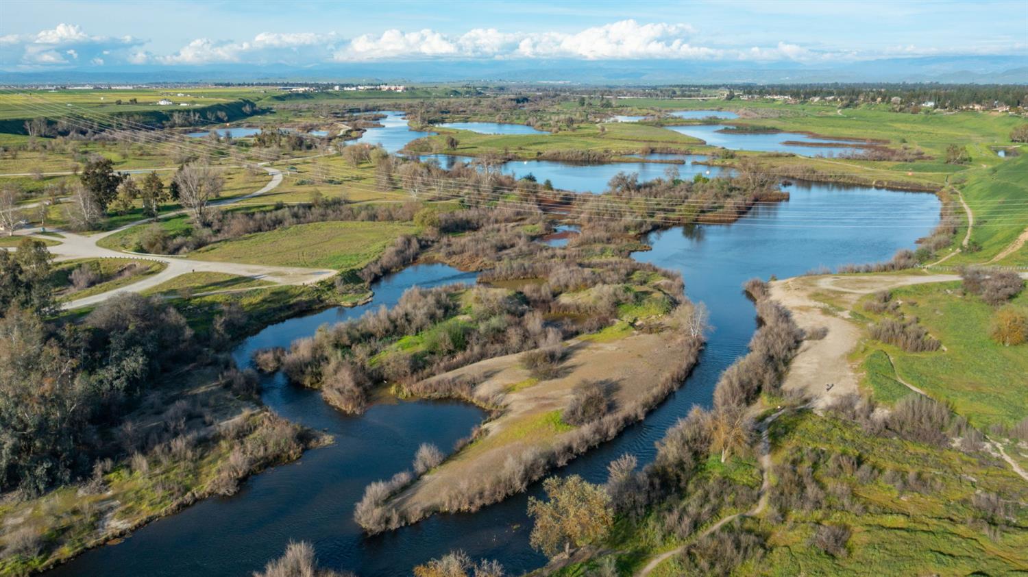 1230 West Moraga Road Fresno, CA 93711 - Photo 61 of 66 an aerial view of ocean and residential houses with outdoor space