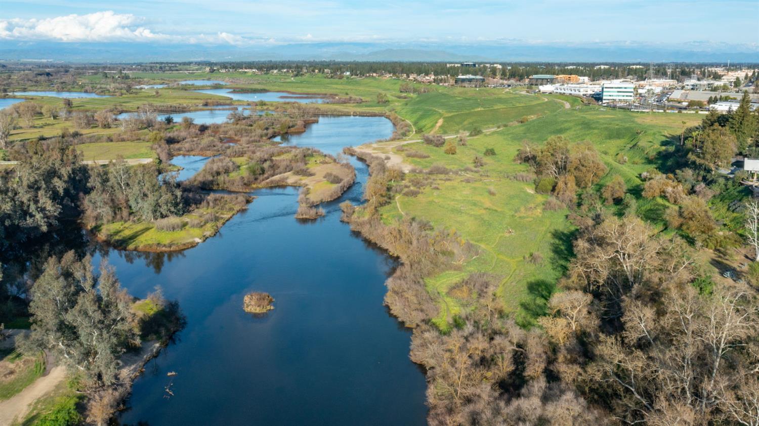 1230 West Moraga Road Fresno, CA 93711 - Photo 62 of 66 a view of a lake with a city
