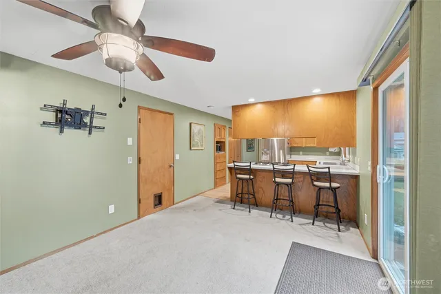 a kitchen with a stove a sink and a refrigerator
